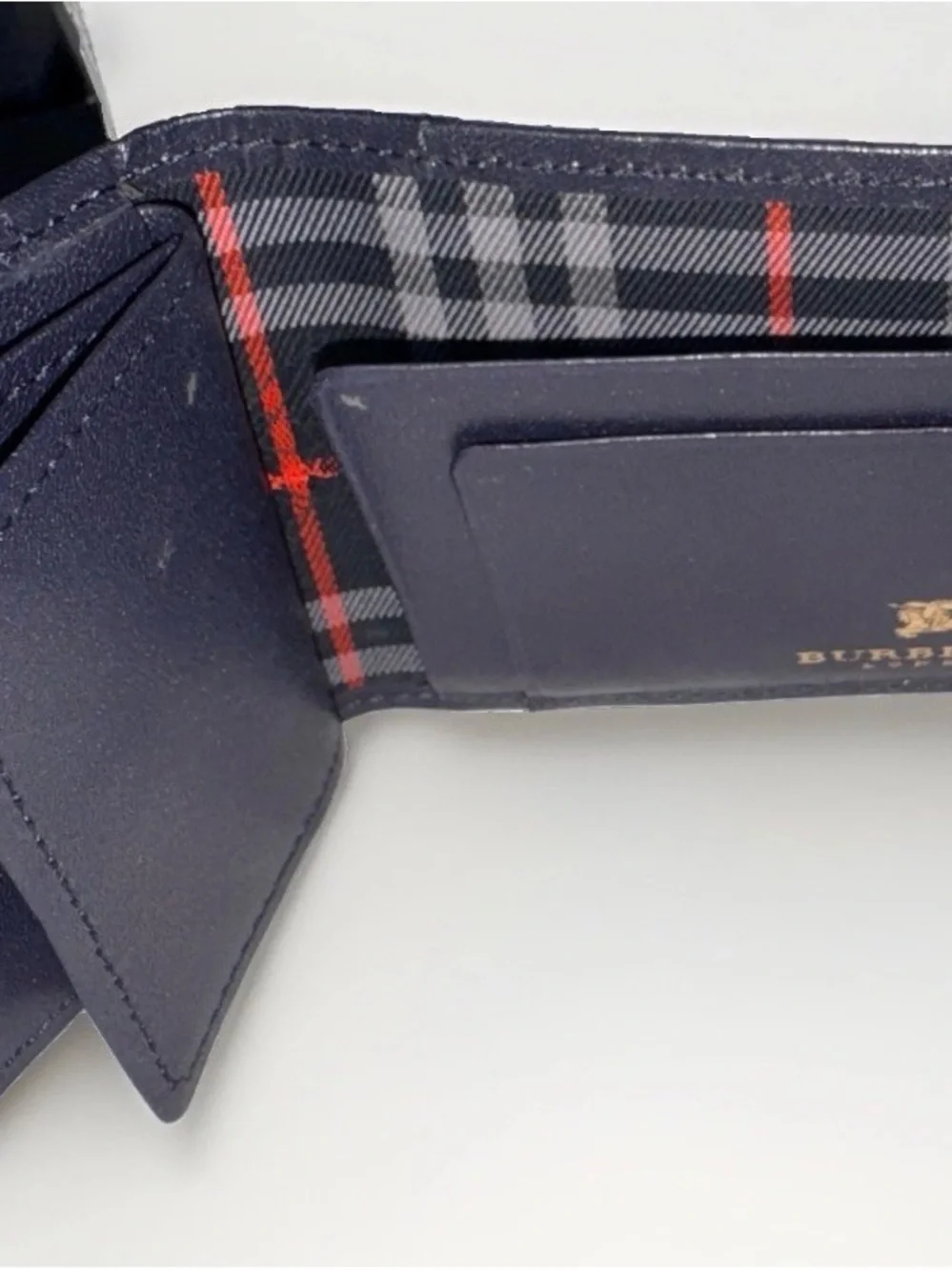 Burberry’s Black Leather Men's Wallet with Plaid Interior